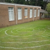 labyrinth painted on the grass at Peter Lee Memorial Methodist Church